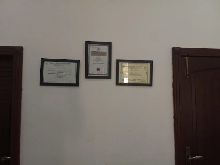 Framed qualification certificates on the wall