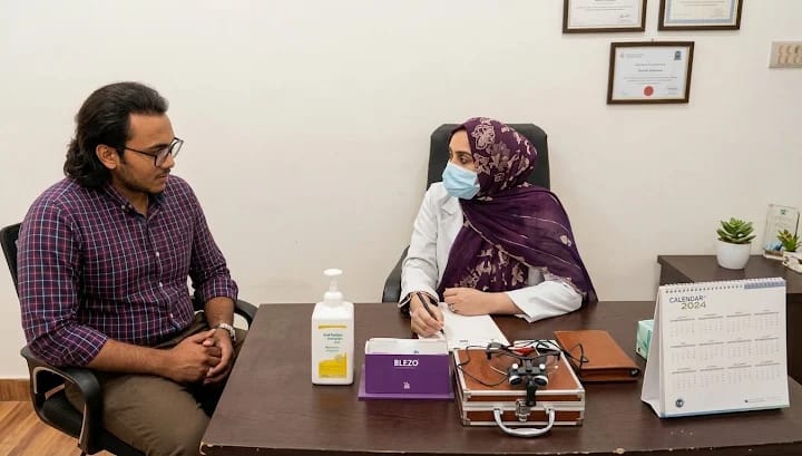 Dr. Arshia Anum consulting with a patient