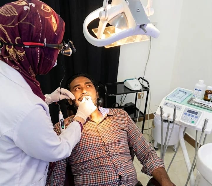 Dr. Arshia Anum examining a patient